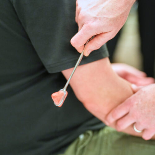 Dr. Bart Vermilya performing a pain evaluation